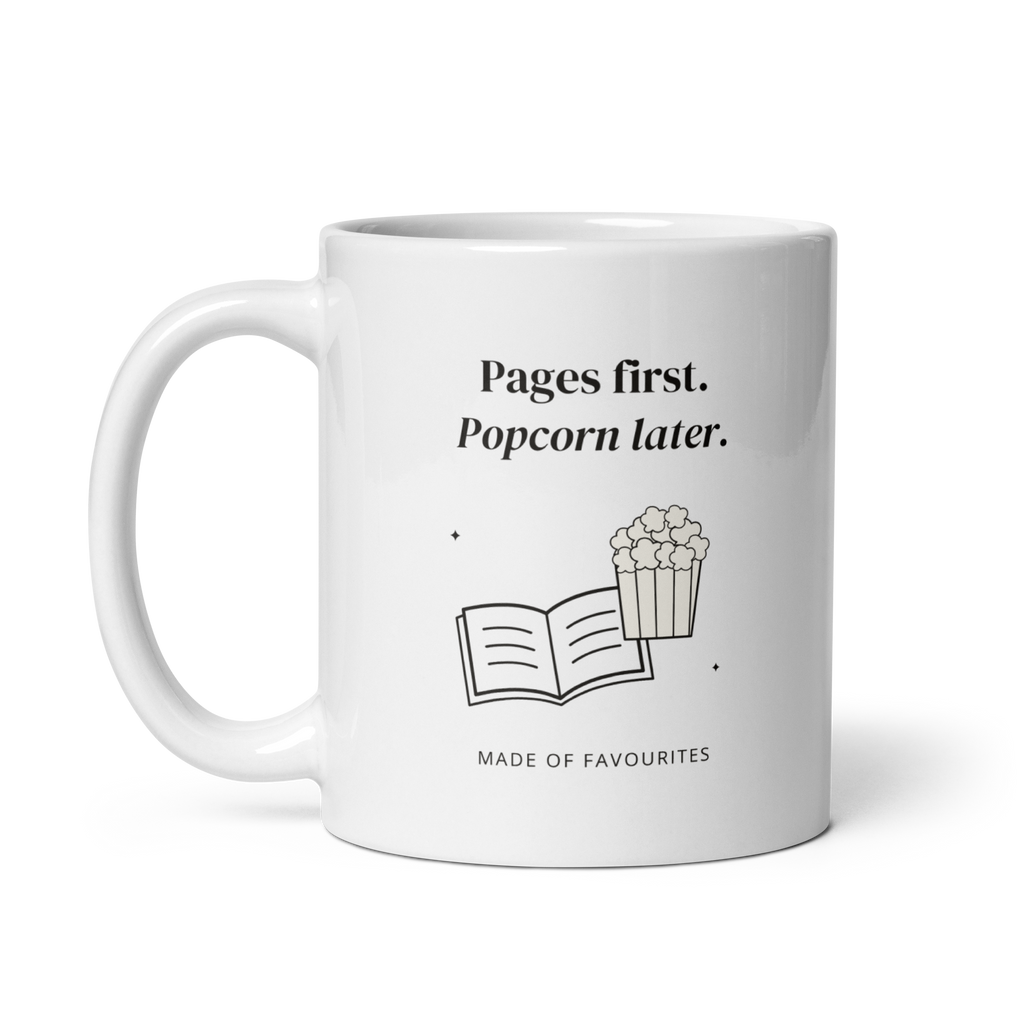 White 11 oz mug with handle on the left, showing Pages first. Popcorn later lettering with a book and popcorn. Supplier-generated mockup; not a physical sample.