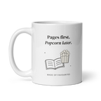 White 11 oz mug with handle on the left, showing Pages first. Popcorn later lettering with a book and popcorn. Supplier-generated mockup; not a physical sample.